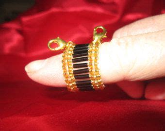 It keeps the threads nicely separated and yet you keep contact with the yarn to get the right tension. yarn guide ring on Etsy, a global handmade and vintage ...