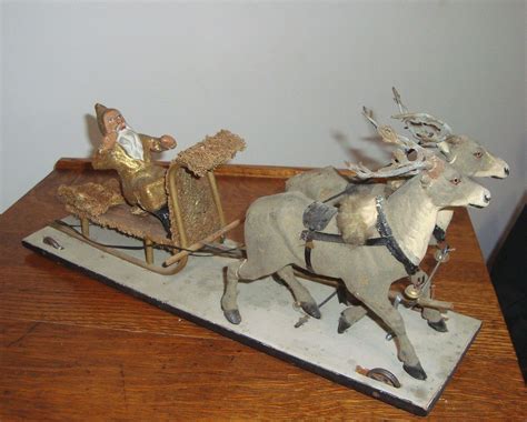 antique german gold santa claus sleigh on wheels pull toy reindeer antique christmas