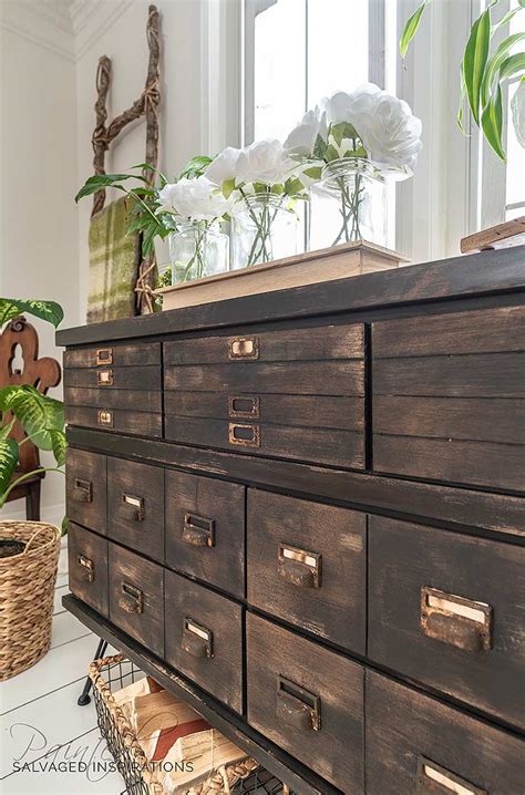 Then i saw an ikea hack on youtube and saw that i could actually make a large majestic looking apothecary dresser for a lot less money. DIY Faux Drawers | Antique Apothecary Cabinet - Salvaged Inspirations
