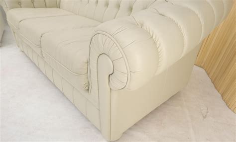Pair Of Off White Leather Upholstery Tufted Chesterfield Sofas Couches