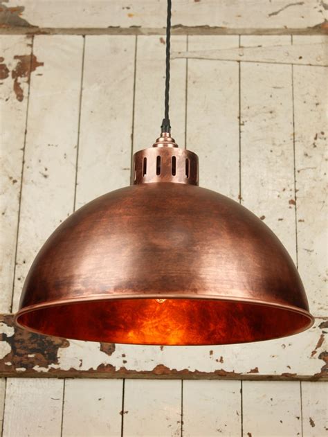 Industrial Ceiling Pendant With A Distressed Antique Copper Dome Shade And Ventilation Detailing