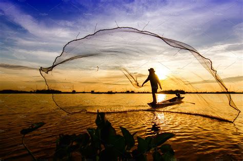 Fishermen Throwing Net Fishing People Photos Creative Market
