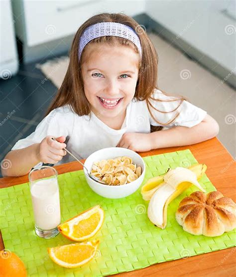 Little Girl Eating Her Breakfast Stock Photo Image Of Flakes Female