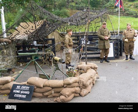 Three Men Dressed As Ww2 Home Guard Soldiers Guarding Goathland