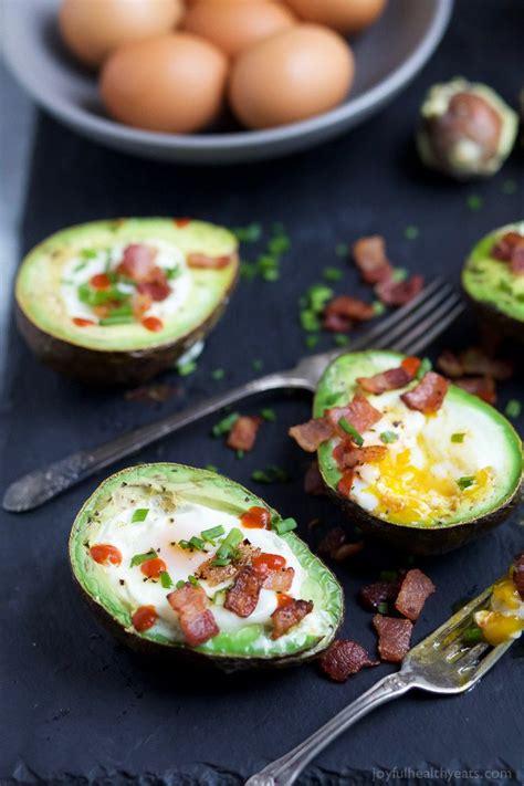 BAKED EGGS IN AVOCADO With Crispy Bacon And A Sriracha Drizzle The