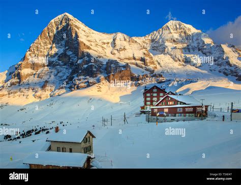Chalets And Hotel With North Face Of The Eiger And Monch Mountains