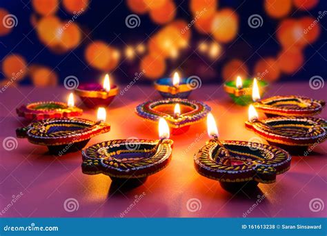 Indian Festival Diwali Diya Oil Lamps Lit On Colorful Rangoli Hindu