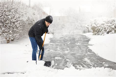 Shoveling Snow From The Driveway Stock Photo Download Image Now Istock