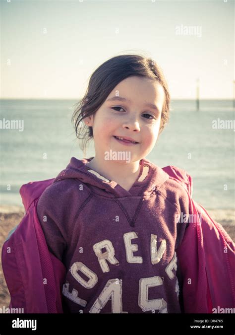 Young Girl Playing On The Beach In Winter Stock Photo Alamy