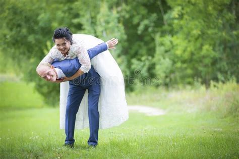 Humorous Wedding Photography Stock Photo Image Of Flower Heaviness