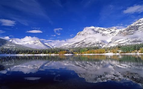 Mountain With Snow Mirrored In Lake Hd Wallpaper Wallpaper Flare