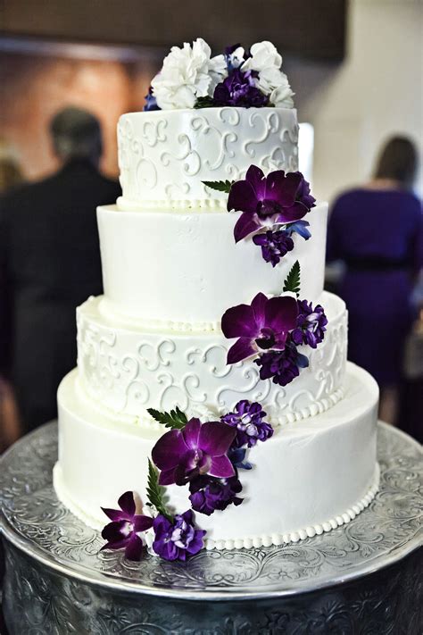 White And Purple Wedding Cake With Cascading Purple