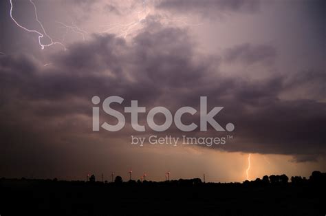 Wind Turbines With Large Lightning Stock Photo Royalty Free Freeimages