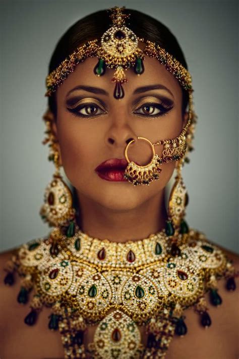 Whilst africa has much more to offer than animals, the beauty that nature has bestowed on this continent cannot be overlooked. The jewelry is gorgeous, but look at her makeup! Beautiful ...