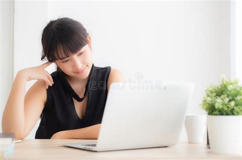 Beautiful Freelance Young Asian Woman Thinking And Idea Working Laptop