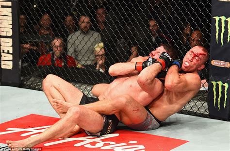 Georges St Pierre Submits Michael Bisping With Rear Naked Choke As The