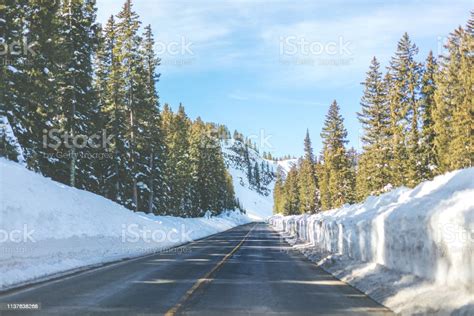 Snowy Winter Mountain Road With High Snow Banks In Western Colorado