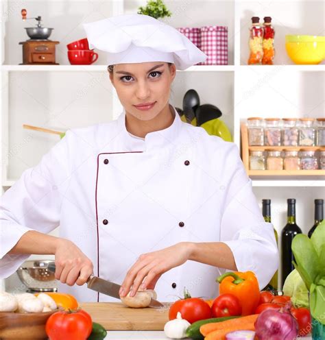 Young Woman Chef Cooking In Kitchen — Stock Photo © Belchonock 18750673