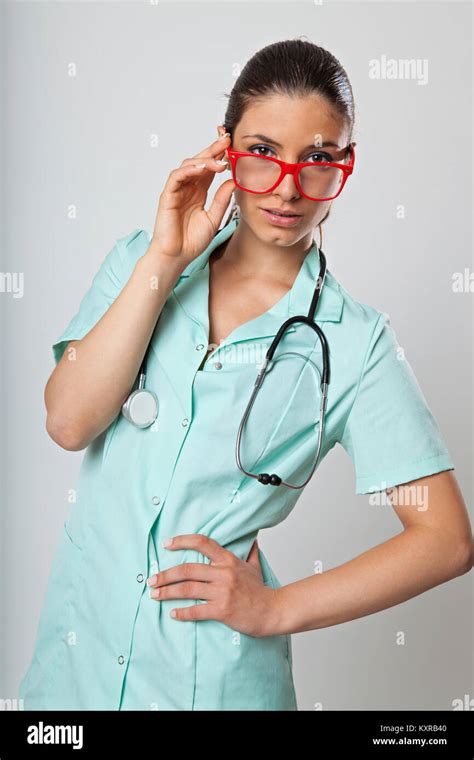 Sexy Woman Doctor With A Stethoscope And Red Glasses On White