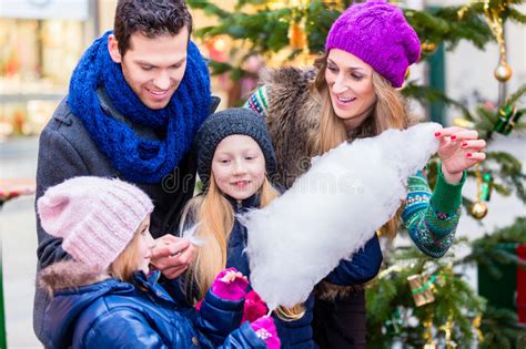 The kingdom was founded by princess bubblegum hundreds of years before the events of adventure time and it was under her reign for a long time. Family Eating Cotton Candy On Christmas Market Stock Photo ...