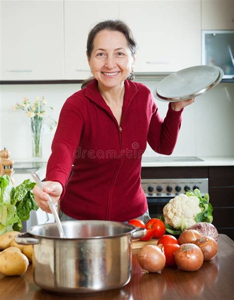 Happy Mature Woman Cooking Lent Diet Soup Stock Photo Image Of Soup