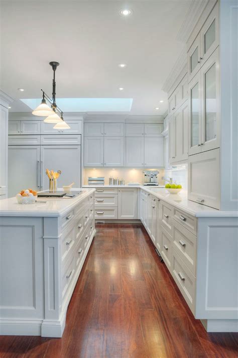 Storage features include a blind corner pull out, roll out pantry shelves, and contrasting white and gray shaker cabinets and quartz countertops. Sparkling White Quartz Countertop For Your Kitchen Design ...