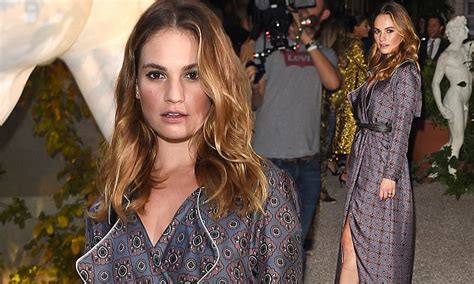 Lily James Flashes A Hint Of Toned Thigh As She Smoulders At The