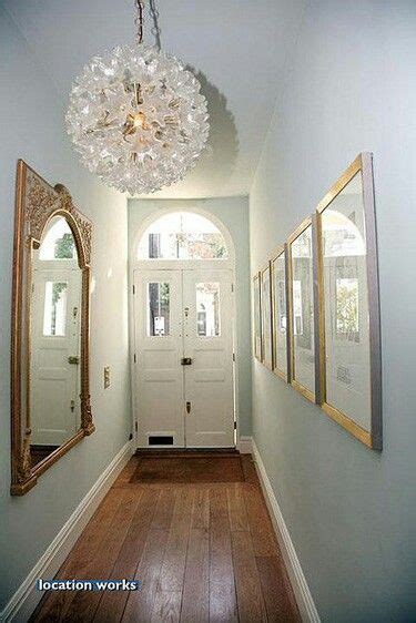 Light Blue Hallway With Gold Accessories And Statement