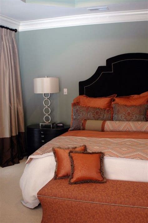 As seen in this room the very subtle light orange walls in this space from chilvers_terrace are the perfect backdrop for the beige and orange accents throughout the room. Sherwin Williams Willow Tree paint...for the bedroom ...