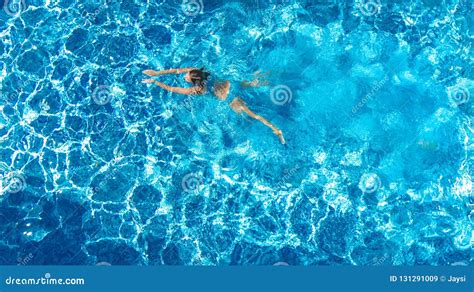 Active Girl In Swimming Pool Aerial Drone View From Above Young Woman