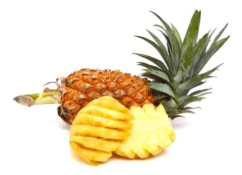 Whole Pineapple Peeled Sliced And Reassembled Isolated On White