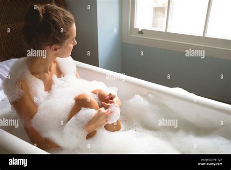 Woman Taking A Bath In Bath Tub Stock Photo Alamy