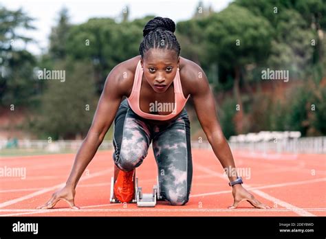 Stock Photo Of An African American Sprinter In Starting Position To