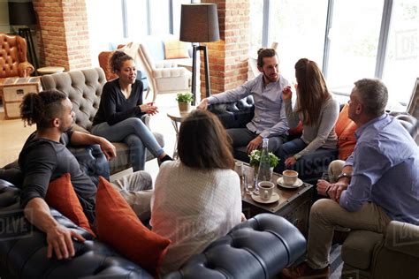 Group Of Friends Meeting For Coffee In Bar Stock Photo Dissolve