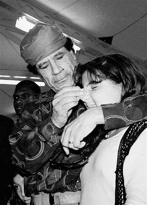 Moammar Gadhafi Wipes The Face Of His Daughter Hana During