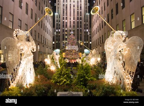 The Christmas Tree At Rockefeller Center And Angels At Night Stock