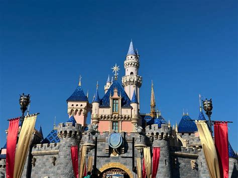photos disney100 medallion star and more decor added to sleeping beauty castle at disneyland