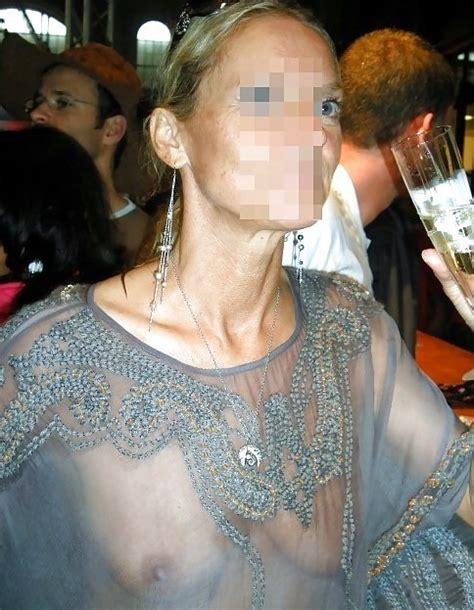 Showing Her Boobs In A Transparent Dress Inside A Bar