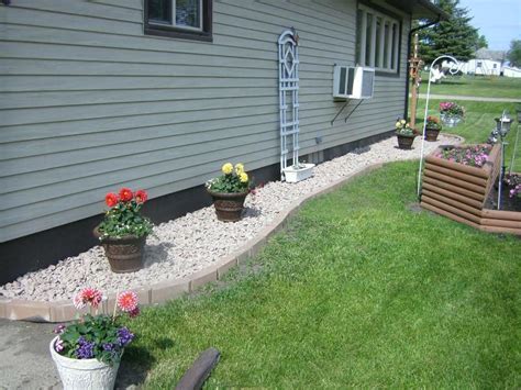 But i am very keen to overcome this with filling my house indoors with plants, but also having some outdoor wall plants. Image result for white rock flower bed | Beautiful yards ...