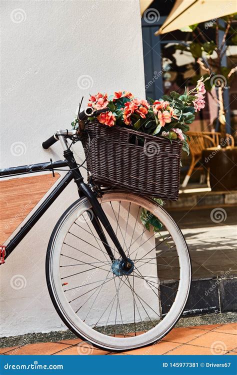 Vintage Bicycle With Basket Against White Wall Background Close Up