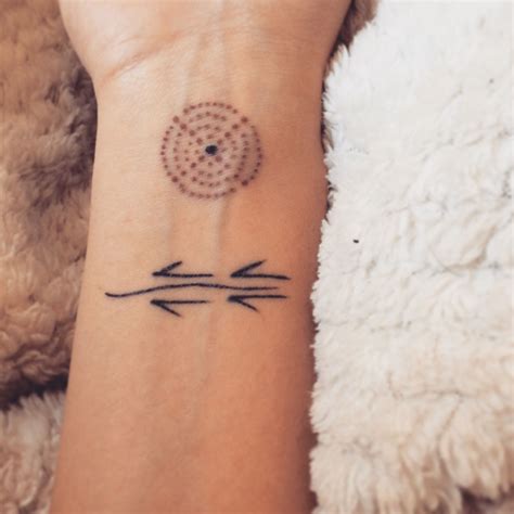 While very simple, this piece is beautiful in its own right. First tattoo! Aboriginal circle and moving kangaroo tracks ...