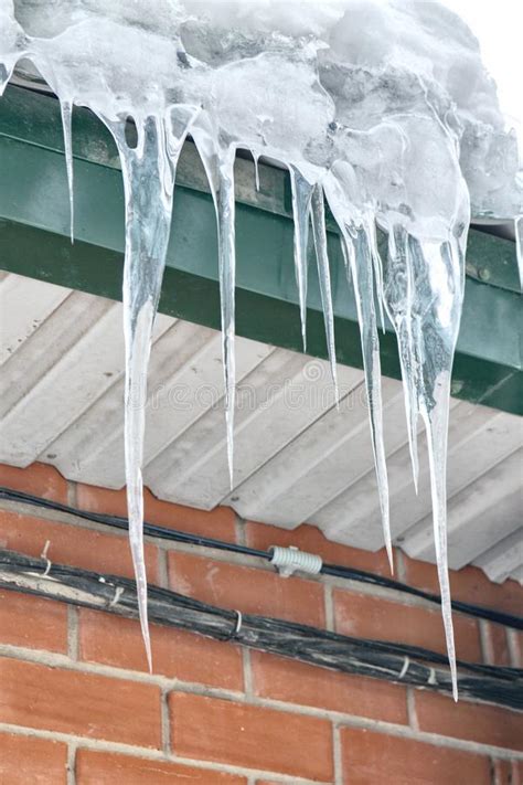 Many Big Icicles On The Winter Roof On A Sunny Day Stock Image Image