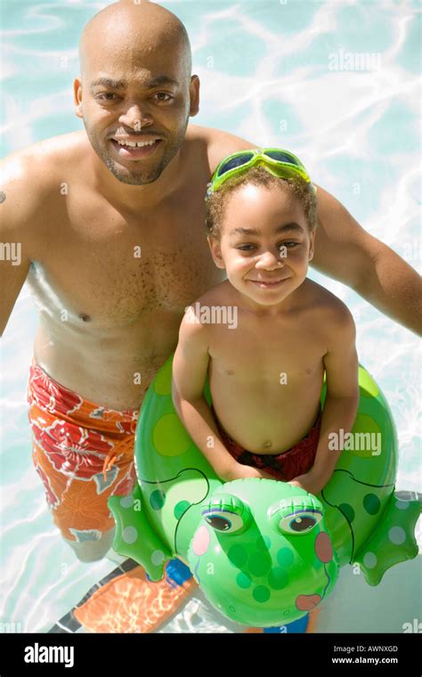 Father And Son Playing In Pool Stock Photo Alamy