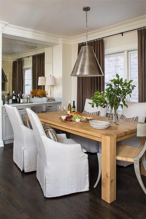 Two very comfy 15 year old club chairs. Big Sur Natural Dining Table with Slipcovered Chairs
