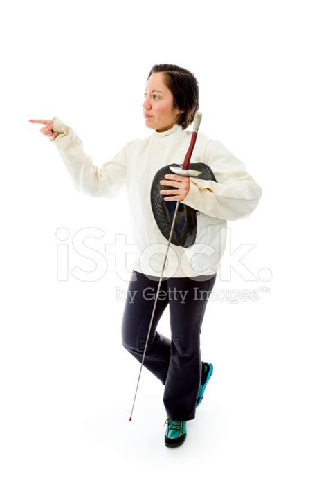 Female Fencer Holding A Mask And Sword With Pointing Up Stock Photo