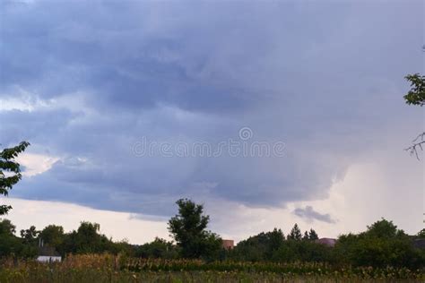 Evening Storm Clouds Over The Village Landscape Stock Photo Image Of