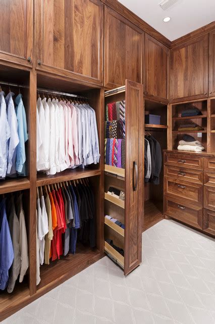 A modern closet provides multiple storage options. Master Bathroom with His and Hers Closets - Traditional ...