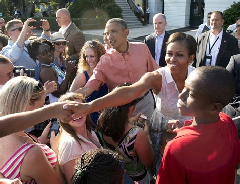president obama and first lady michelle greeted the crowd during the obamas fourth of july