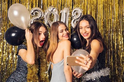 Free Photo Joyful Girls Taking Selfie On New Year Party