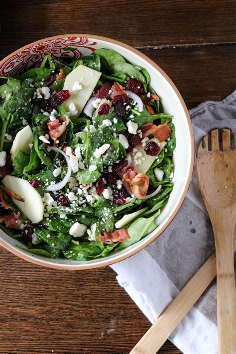 Packed with spinach, this apple spinach salad with toasted cashews is dressed with a tangy apple cider vinaigrette and mixed with creamy cashews and sweet apple slices and raisins. Apple Cranberry Spinach Salad - Wanderlust and Wellness